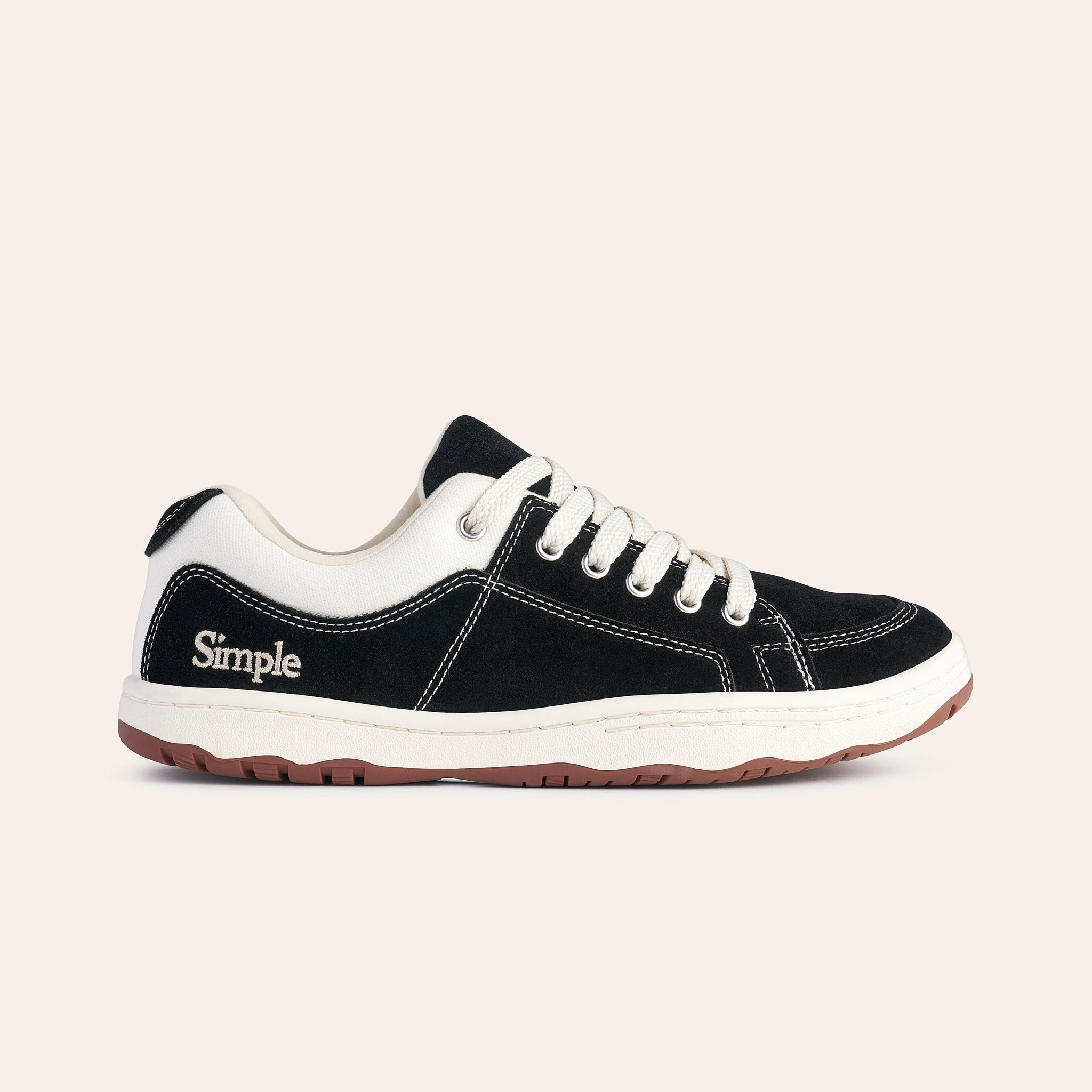 Men's black suede sneakers with white accents and lace-up design for casual wear.