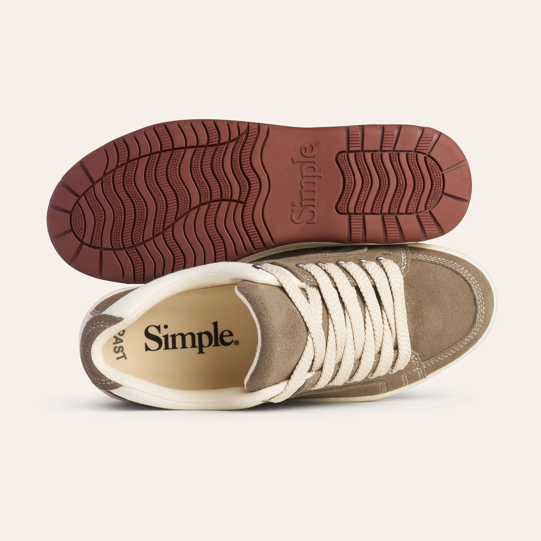 Simple brand brown suede sneakers with cream laces and rubber sole, ideal for casual outings.