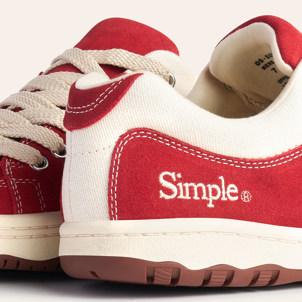 Red and white Simple sneakers made of canvas with durable rubber sole and classic lace-up design.