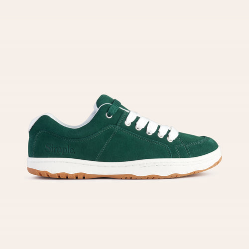 Green suede sneakers with white laces and rubber sole, perfect for casual wear.
