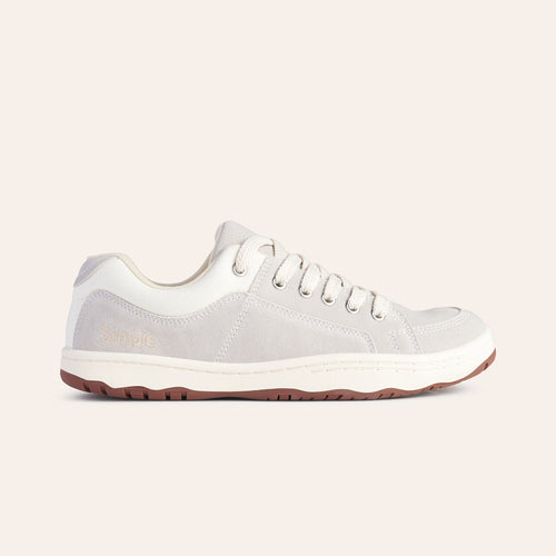 Light grey casual sneakers with suede material and white accents, featuring a comfortable lace-up design.