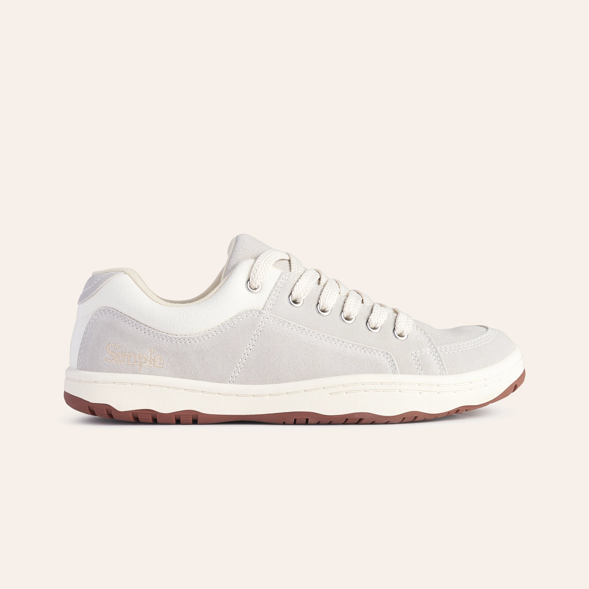 Light gray casual sneakers with suede material and white accents, featuring lace-up closure and rubber outsole.