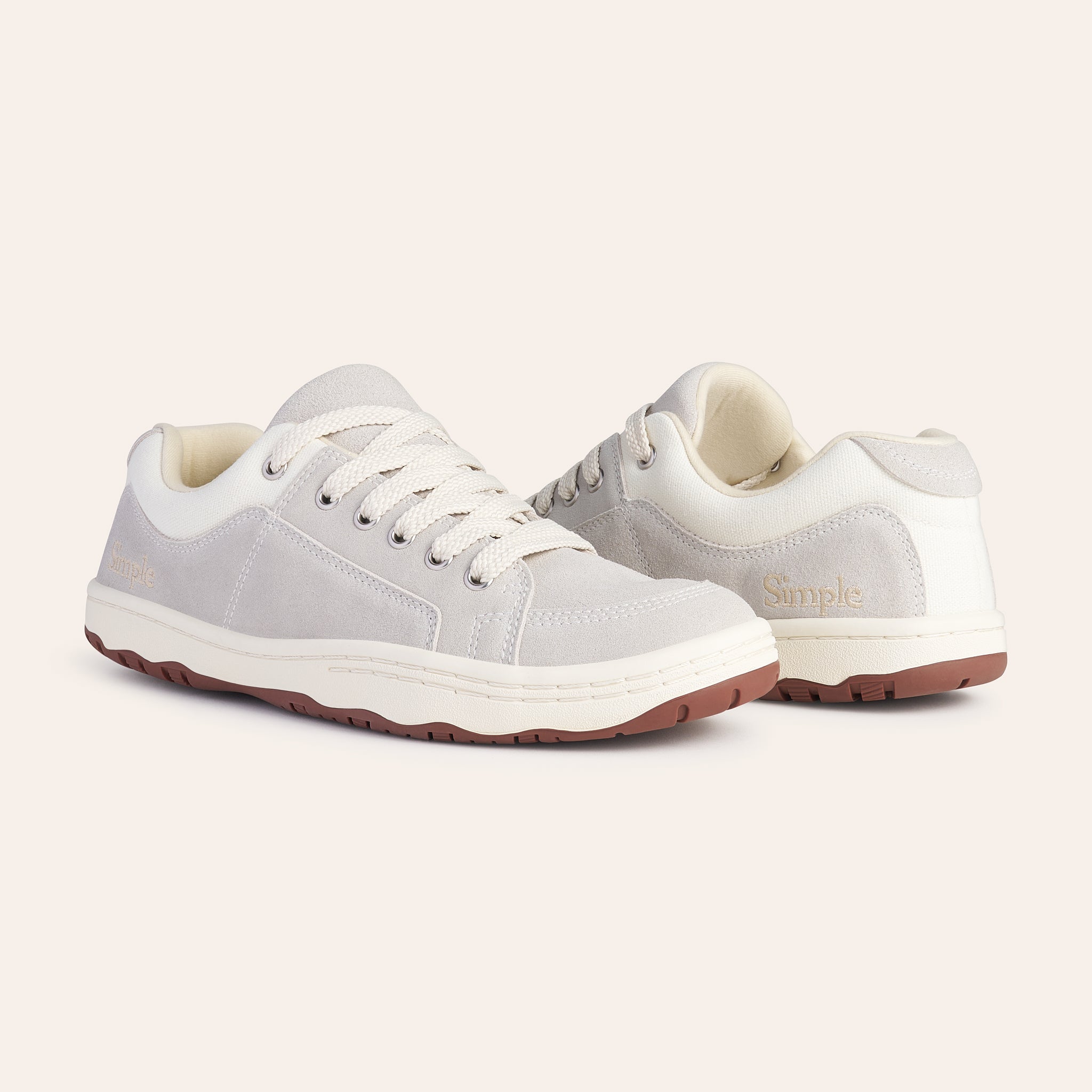Light gray casual shoes with suede and canvas, featuring a comfortable lace-up design and rubber sole.
