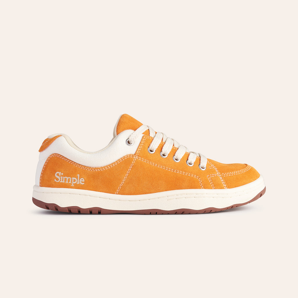 Orange suede sneakers with beige accents and lace-up design for casual wear.