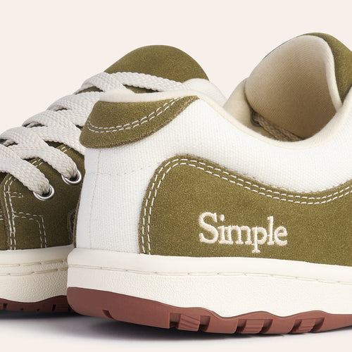 Simple brand sneakers in olive green and white canvas with rubber sole and lace-up design.